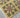 Holly - A floral-patterned rug with green and red flowers on a mustard background.